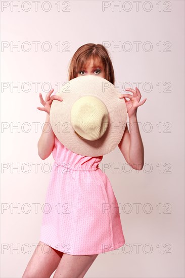 Woman with hat in hand