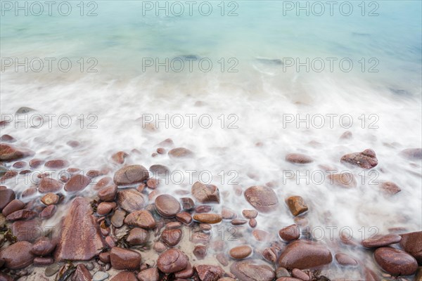 Detail of the swell on a sand and stone beach on the north-west coast of Scotland