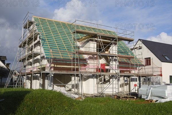 House in shell with scaffolding