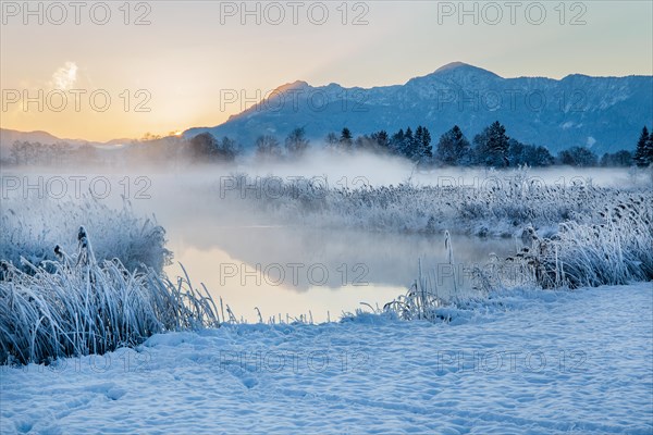 Snowy winter landscape with the Uffinger Ach at sunrise with Herzogstand 1731m and Heimgarten 1790m