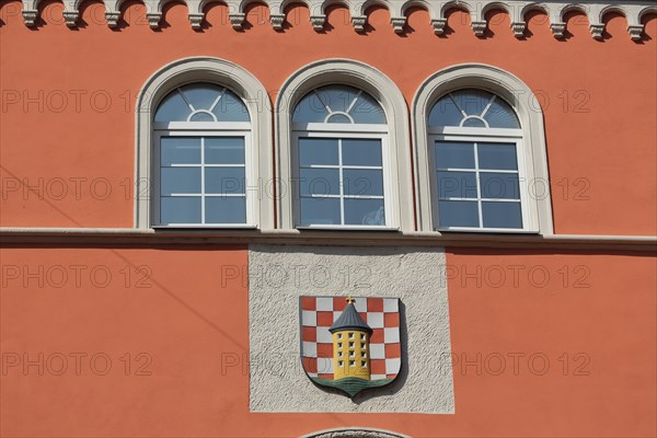 Facade with three windows and town coat of arms from the historic town hall