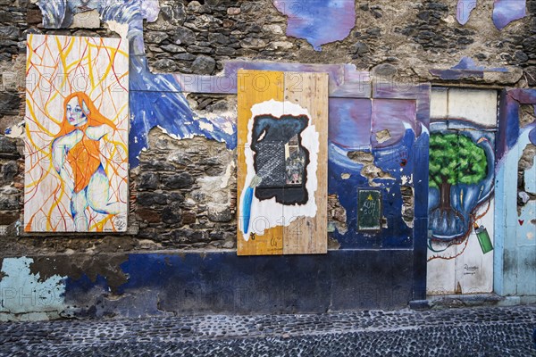 Alley with colourfully painted doors