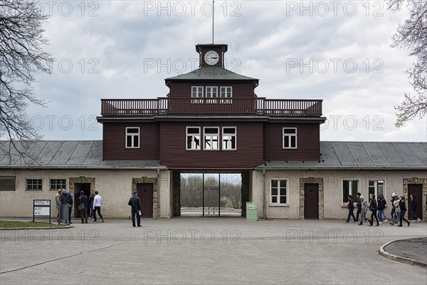 Visitors at the gate to the camp