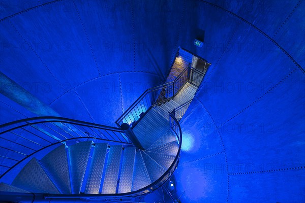 Blue lit former water tank in the historic water tower