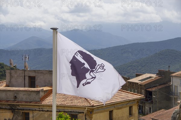 Corsican flag flying in a village in the Corsican mountains