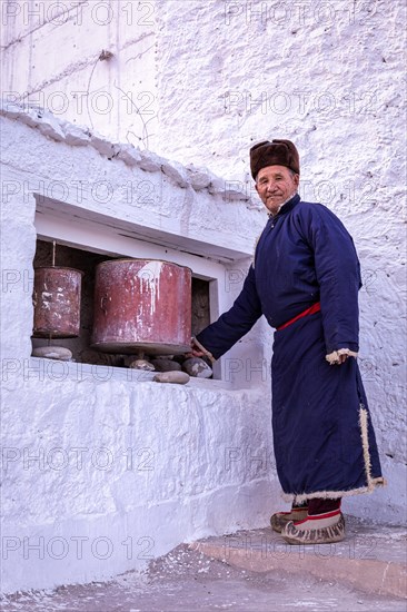 Elderly man in traditional Ladakhi clothes