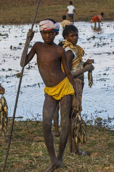 Proud boy presenting his fresh caught fish