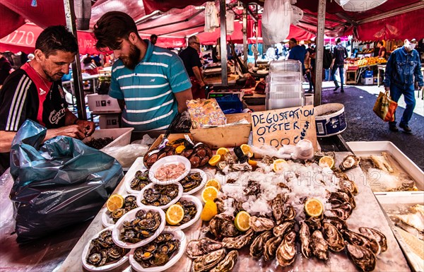 Historic fish market La pescheria with a cornucopia of colourful sea creatures