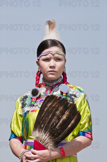 Female dancer in jingle dance regalia