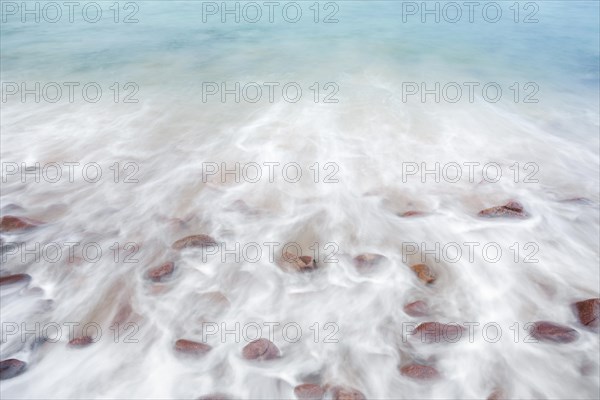 Detail of the swell on a sand and stone beach on the north-west coast of Scotland