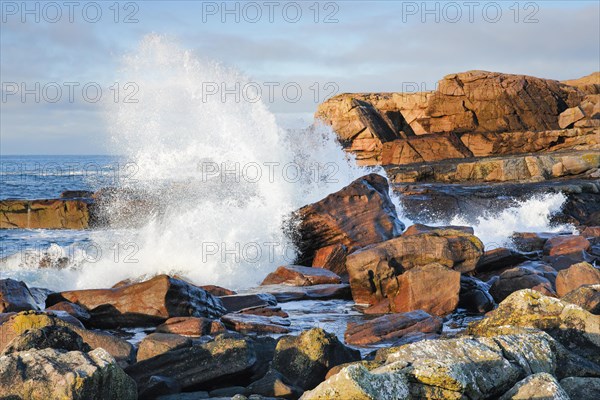 Water dashing against rocks on the rocky coast of Isle of Skye