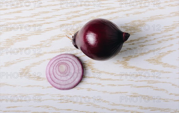 Onion and onion slices on the background in view