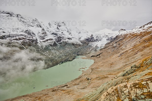 Clouds lying in the valley at Pasterze Hochalpengletscher