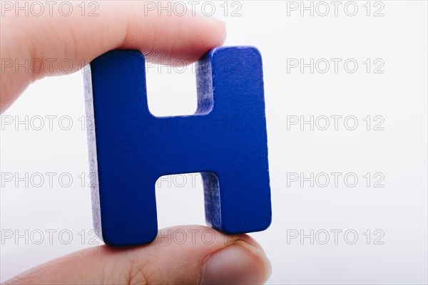 Letter cube of H of Alphabet made of wood