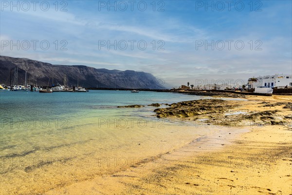 Beach and white architecture in Caleta del Sebo