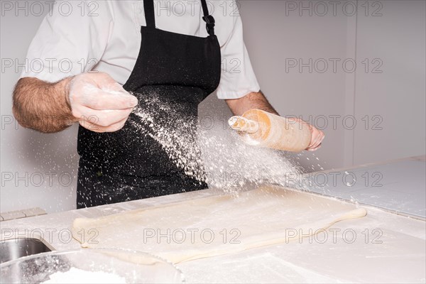 Man baking homemade croissants