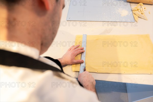 Man baking homemade croissants