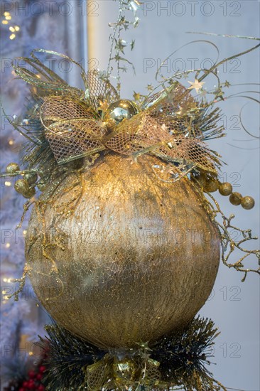 Merry Christmas with golden decorative ball in view