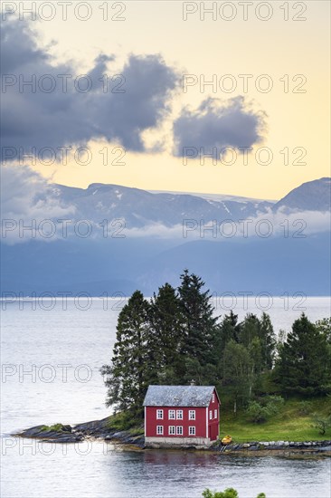 Typical red house on the island of Omaholmen in Hardangerfjord