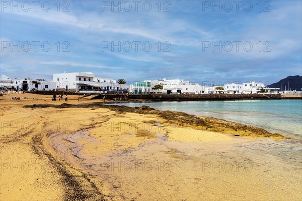 Beach and white architecture in Caleta del Sebo