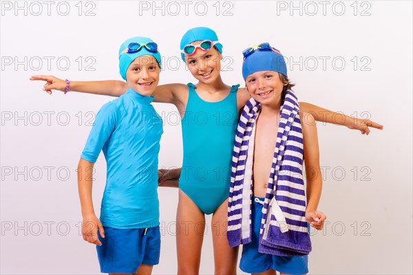 Portrait of brothers dressed in swimsuits for swimming lessons in the pool. White background