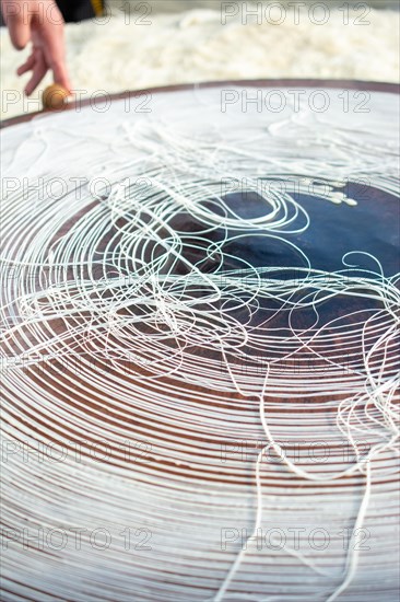 The making of Turkish desert Kadayif pastry in display