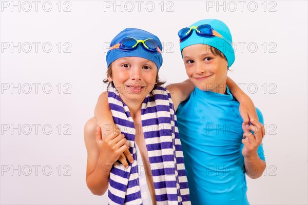 Brothers dressed and hugged in their swimsuits for swimming lessons in the pool in the summer. White background