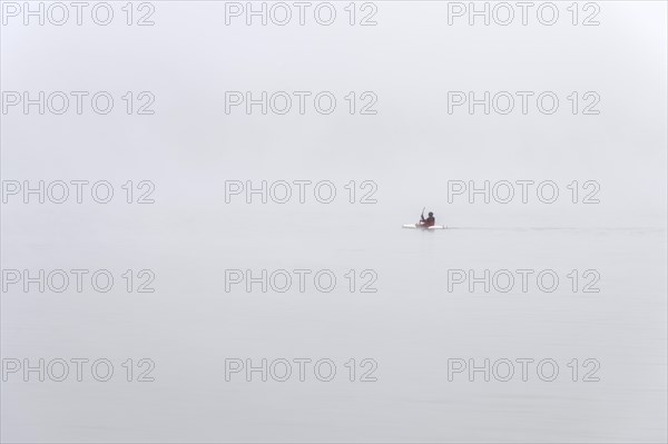 Kayakers in dense fog on Lake Diemel
