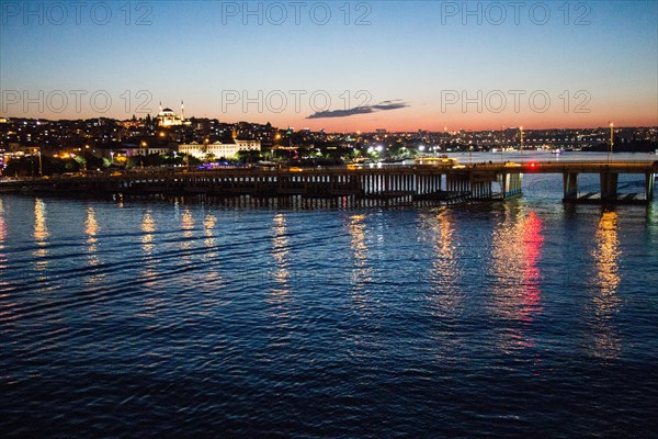 Ataturk bridge on Golden Horn at night on display