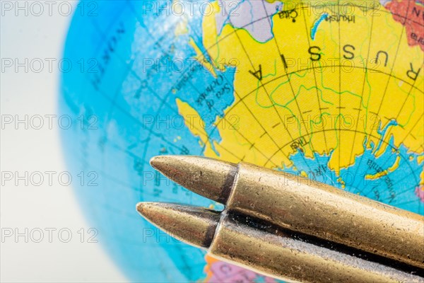 Bullet on a globe as against the war conceptual photography