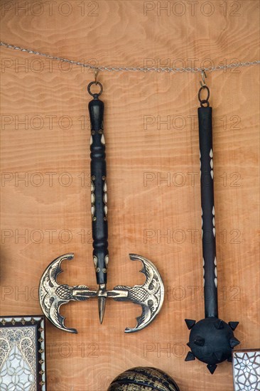 War axe and mace on a wooden background