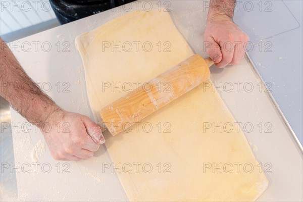 Man baking homemade croissants