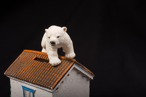 Polar bear model placed on a model house