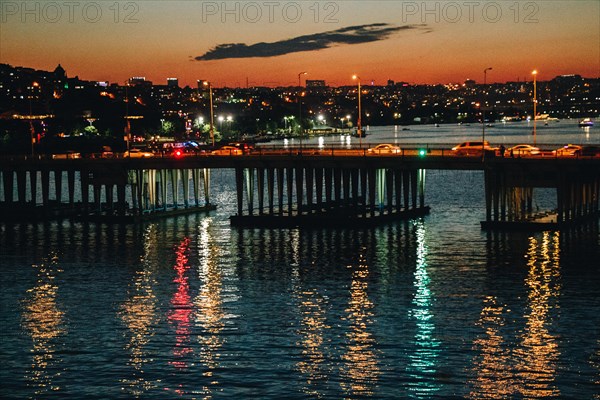 Ataturk bridge on Golden Horn at night on display