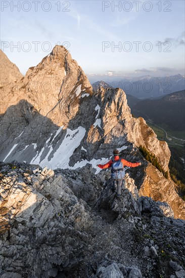 Hikers at the summit of Schartschrofen at sunset