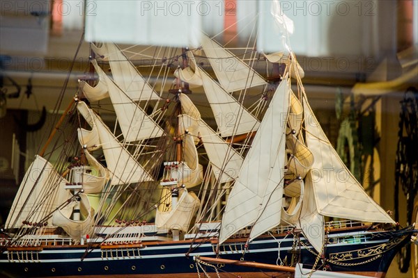 Mini size little colorful model sailboat in view