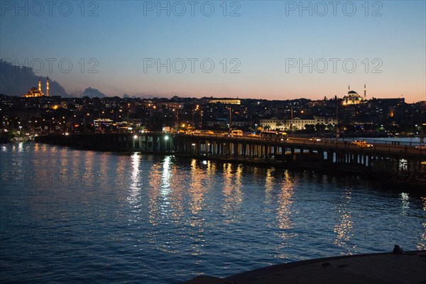 Ataturk bridge on Golden Horn at night on display