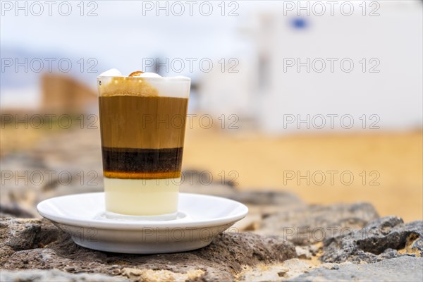 Delicious barraquito coffee with liquor and condensed milk