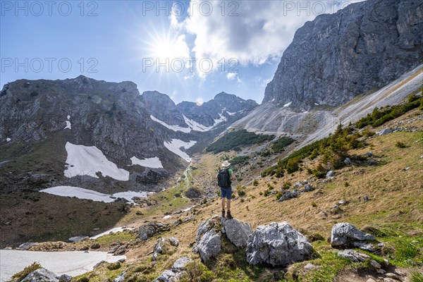 Hiker standing on a stone