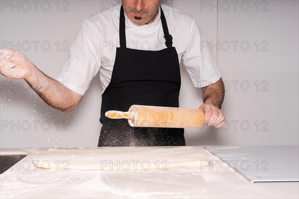 Man baking homemade croissants