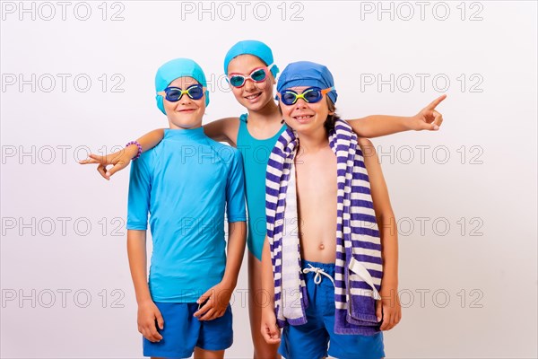 Portrait of brothers dressed in swimsuits for swimming lessons in the pool. White background