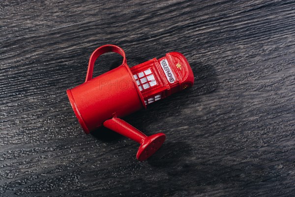 British style Red phone booth model in watering can