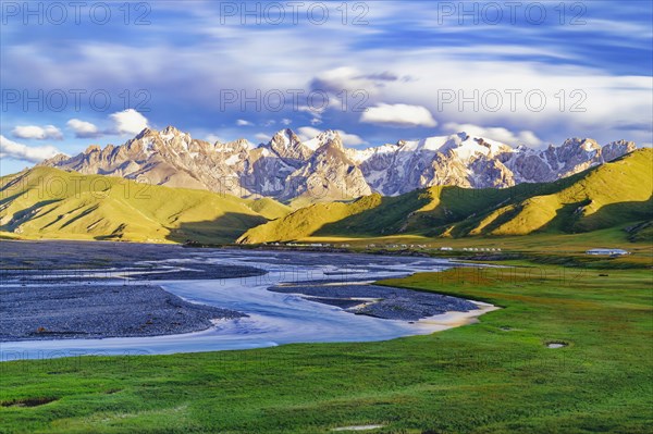 Sunset over the Central Tien Shan Mountains and glacier river