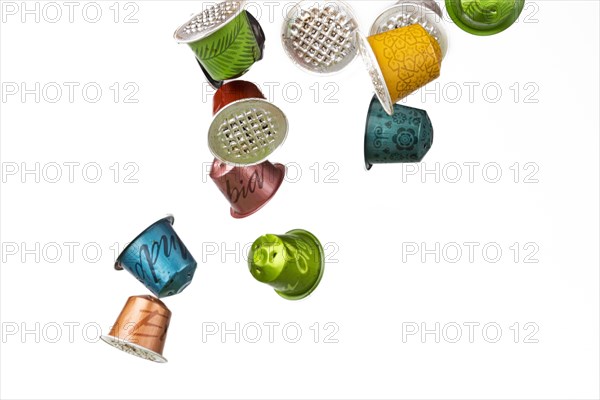 Different coloured used coffee capsules