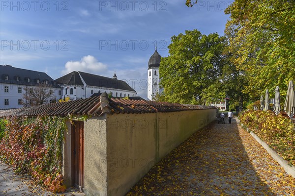 Bell tower with monastery wall of the monastery complex on Fraueninsel