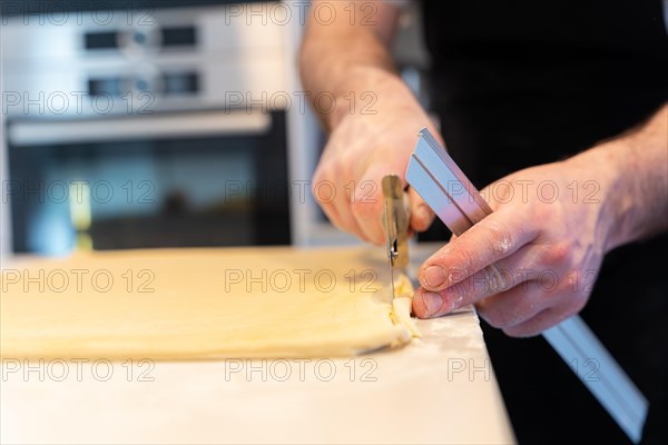 Man baking homemade croissants