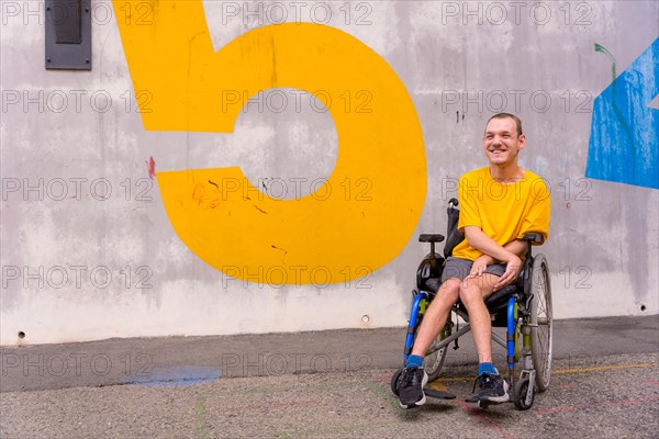 Disabled person in a public park in a wheelchair