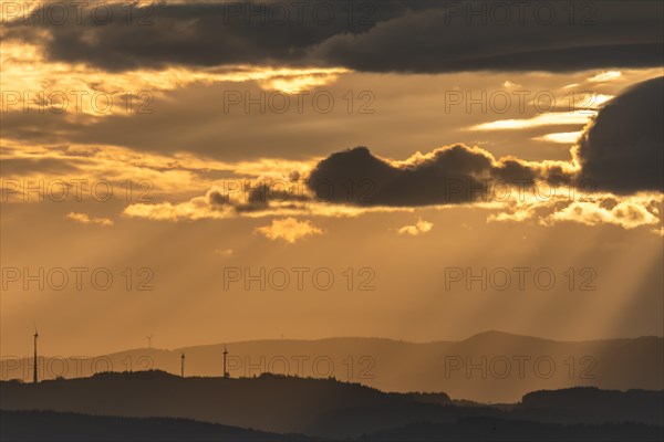 Wind turbines on the mountains of the Black Forest at dawn. Freiburg brisgau