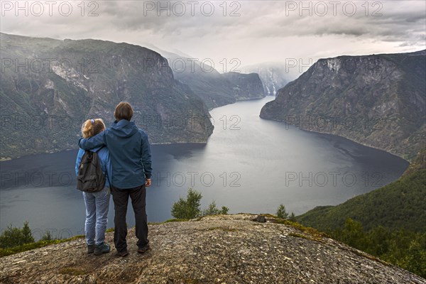Father and daughter on Mount Prest looking over the Aurlandsfjord in Norway
