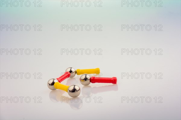 Magnet toy bars and magnetic balls on a white background